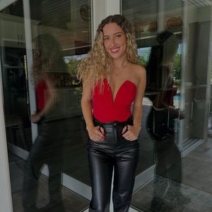 Red body suit with deep V neck line